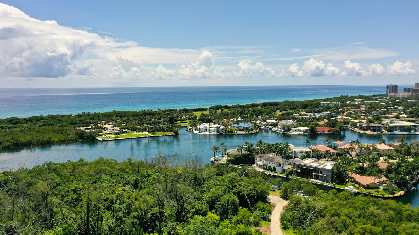 Aerial view of Boca Raton waterfront homes and ocean horizon.