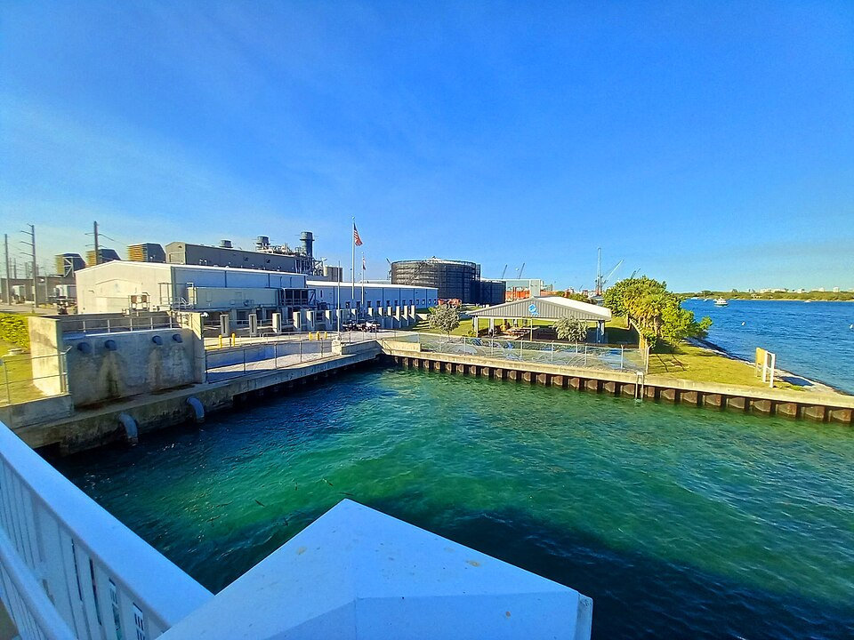 - Manatee Lagoon industrial waterfront with energy plant and observation deck.