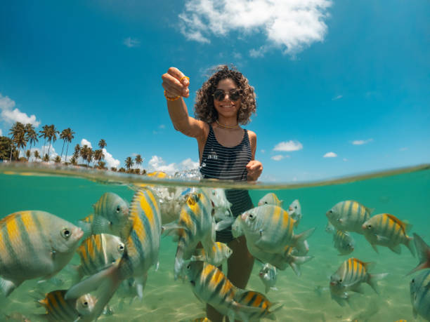 Woman Feeding Fish