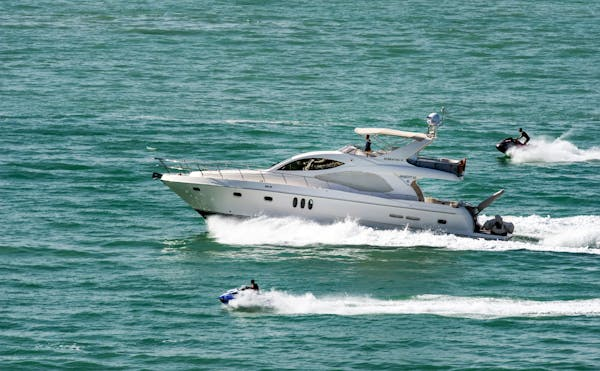 Boat and Jet Skis on the Water