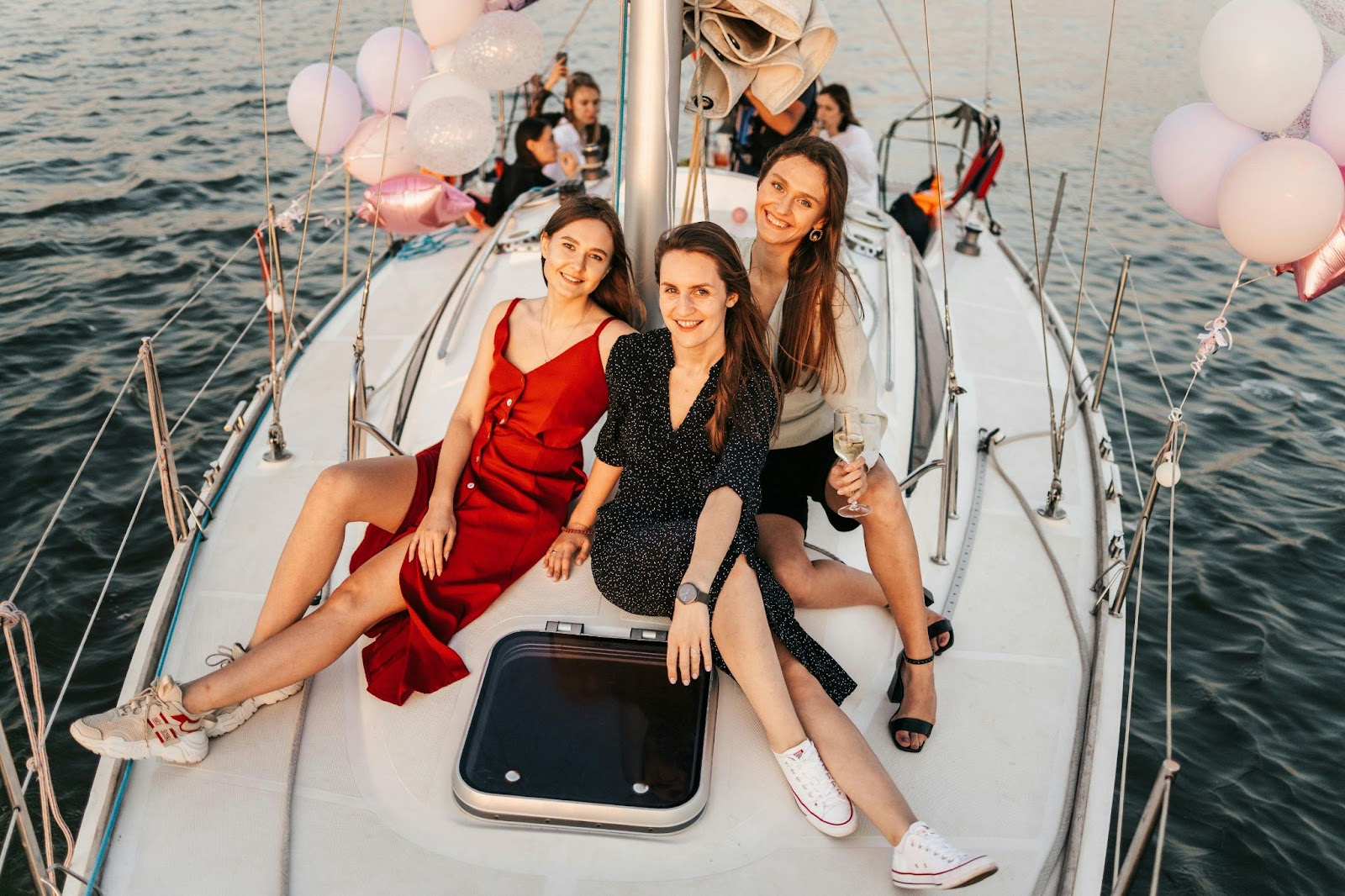 Girls taking photos on a yacht