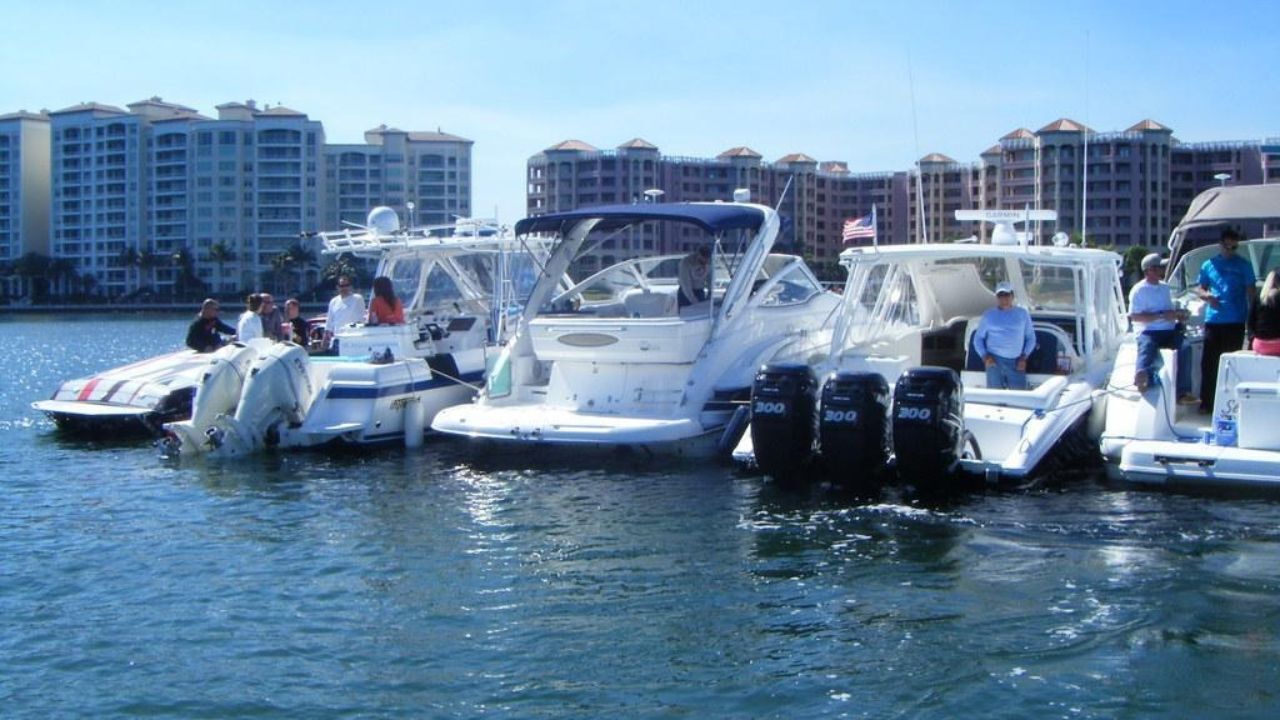  Boats gathered at Lake Boca Sandbar near waterfront residences 