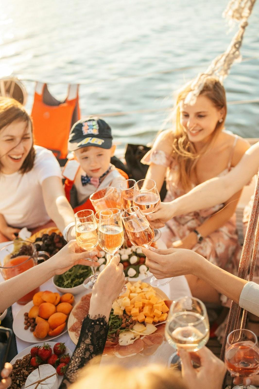 Group of People clinking glasses of champagne on a yacht